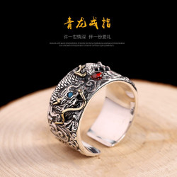 Dragon Ring holding red and...