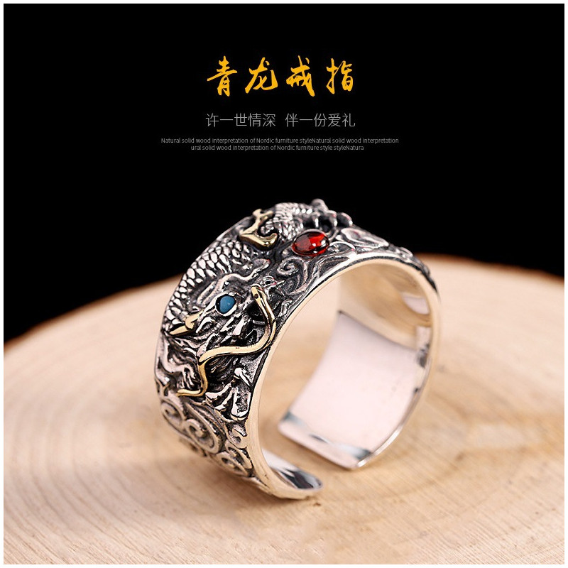 Dragon Ring holding red and blue pear