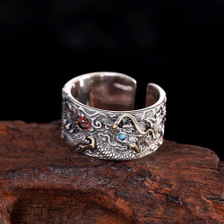 Dragon Ring holding red and blue pear