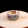 Dragon Ring holding red and blue pear